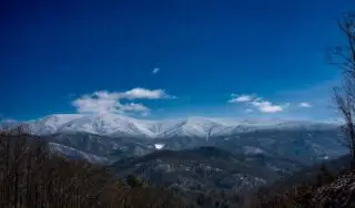 Frost Line - I woke up yesterday to this wonderful view of the Big Bald Mountain located along the TN/NC border of Unicoi/ Madison County line. The Appalachian Trail traverses the Big Bald Mountain at an altitude of 5,492 feet. 

It’s so neat to see the Rime Ice and snow capping the mountain. While below the line we only had snow on the ground. I love the details you can see in the mountains where the snow creates greater contrast with the ground revealing the ground topography which usually blends in with the trees. #winter #tennessee #easttennessee #unicoicountytn #tennesseestrong #appalachiastrong #photography #snowcapped #snowcappedmountains #landscapephotography #directorofphotography #naturalwonders #rimeice #snow #snowscape #sonyalpha #sonya9iii #sonyphotography #sonypro